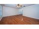 Spacious living room featuring hardwood floors, ceiling fan, and neutral color palette at 2707 Morningside Dr, Clearwater, FL 33759