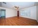 Bright living room featuring hardwood floors, large window, ceiling fan, and inviting space at 2707 Morningside Dr, Clearwater, FL 33759