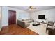 Bright living room with hardwood floors, modern sofa, and stylish decor with natural light at 2707 Morningside Dr, Clearwater, FL 33759