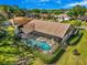 Aerial view showcasing the pool and well-maintained backyard with privacy hedges at 2806 Forest Club Dr, Plant City, FL 33566