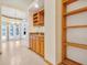 Open-concept bar area with built-in wine rack and cabinets, plus built-in bookcase for storage at 2806 Forest Club Dr, Plant City, FL 33566