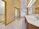 Spacious bathroom featuring double sinks, tile flooring, and a view of the shower and toilet, maximizing space and functionality at 2806 Forest Club Dr, Plant City, FL 33566