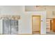 Bright bedroom featuring neutral carpet, closet, and sliding glass doors offering seamless transition to outdoor space at 2806 Forest Club Dr, Plant City, FL 33566