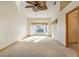 Bright and airy bedroom with large bay window, neutral carpet, and ceiling fan, offering a cozy and relaxing atmosphere at 2806 Forest Club Dr, Plant City, FL 33566