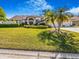 A single-story home with a three-car garage has mature landscaping and a well-kept lawn at 2806 Forest Club Dr, Plant City, FL 33566