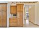 Beautiful kitchen with built-in wooden cabinets, drawers, and shelving and access to hall at 2806 Forest Club Dr, Plant City, FL 33566