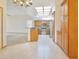 Spacious kitchen with skylight, stainless steel appliances, granite countertops, and wooden cabinetry at 2806 Forest Club Dr, Plant City, FL 33566