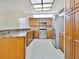 Well-equipped kitchen with wooden cabinets, granite countertops, and stainless steel appliances at 2806 Forest Club Dr, Plant City, FL 33566