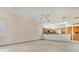 Spacious living room with vaulted ceiling and a view into the kitchen at 2806 Forest Club Dr, Plant City, FL 33566