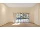 Bright living room featuring large glass doors offering a view of the pool and access to the outdoor area at 2806 Forest Club Dr, Plant City, FL 33566