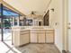 Outdoor patio featuring tile countertop, cabinetry, sink, fan, and view of pool area and backyard at 2806 Forest Club Dr, Plant City, FL 33566