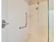 Modern shower with grab bar and dual shower heads, combining accessibility with contemporary design at 2806 Forest Club Dr, Plant City, FL 33566