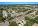 An aerial view shows the neighborhood, landscaping, and attached garages at 2991 Covewood Pl, Clearwater, FL 33761