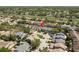 The aerial view showcases the property's prime location within a well-established neighborhood, surrounded by lush greenery and mature trees at 2991 Covewood Pl, Clearwater, FL 33761
