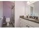 Updated bathroom features a vanity with granite countertops, a toilet, and a glass enclosed shower at 2991 Covewood Pl, Clearwater, FL 33761