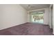 Spacious bedroom with sliding glass doors to screened patio and vaulted ceiling at 2991 Covewood Pl, Clearwater, FL 33761