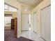 The foyer boasts neutral walls, white tile floors, and a closet creating a clean and inviting entrance at 2991 Covewood Pl, Clearwater, FL 33761