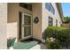 Inviting front entrance with a decorative wreath and colorful potted plants creating a warm welcome at 2991 Covewood Pl, Clearwater, FL 33761