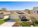 Beautiful single-Gathering home showcasing a well-manicured lawn, a two-car garage, and inviting curb appeal with mature landscaping at 2991 Covewood Pl, Clearwater, FL 33761