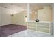 Open concept living and dining area features tile and carpeted floors, and neutral paint at 2991 Covewood Pl, Clearwater, FL 33761
