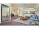 Open living area with chandelier, cabinets, and lots of natural light at 2991 Covewood Pl, Clearwater, FL 33761