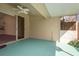 Covered patio space with tile floor, ceiling fan and sliding door access to backyard at 2991 Covewood Pl, Clearwater, FL 33761