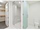 Stylish bathroom showcasing a glass-enclosed shower, closet, and contemporary design at 301 1St S St # 1206, St Petersburg, FL 33701