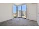 Bright bedroom with large windows offering scenic city views and neutral carpeting at 301 1St S St # 1206, St Petersburg, FL 33701
