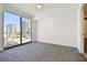 Bright bedroom featuring a large window with city views and neutral carpeting at 301 1St S St # 1206, St Petersburg, FL 33701