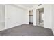 Bright bedroom with walk-in closet, neutral carpet, and white trim; perfect for relaxation at 301 1St S St # 1206, St Petersburg, FL 33701