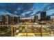 Balcony view of the city skyline at dusk with modern buildings and vibrant streetlights at 301 1St S St # 1206, St Petersburg, FL 33701