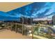 Balcony view of the illuminated city skyline at night with modern buildings and parking at 301 1St S St # 1206, St Petersburg, FL 33701