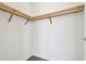 Organized walk-in closet with wooden shelving providing ample storage and clean lines at 301 1St S St # 1206, St Petersburg, FL 33701