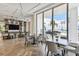 Bright dining area with ocean views, featuring modern tables and chairs, perfect for entertaining at 301 1St S St # 1206, St Petersburg, FL 33701
