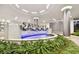 Close-up of the 'SALTAIRE' water feature with modern design and lush greenery at 301 1St S St # 1206, St Petersburg, FL 33701