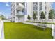 Building with a turf lawn and a picnic bench at 301 1St S St # 1206, St Petersburg, FL 33701