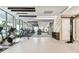 Well-lit gym with a variety of cardio and weight equipment, floor to ceiling windows, and mirrors to monitor form at 301 1St S St # 1206, St Petersburg, FL 33701