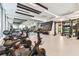 Fully-equipped gym featuring multiple Peloton bikes, free weights, and weight machines for a variety of fitness routines at 301 1St S St # 1206, St Petersburg, FL 33701