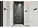 Hallway with unit door, trash room, and sleek, modern design at 301 1St S St # 1206, St Petersburg, FL 33701