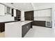 Modern kitchen showcases sleek cabinetry, stainless steel appliances, and a large island with quartz countertop at 301 1St S St # 1206, St Petersburg, FL 33701