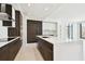 Modern kitchen with a center island, stainless steel appliances, and tile flooring offering ample space to move around at 301 1St S St # 1206, St Petersburg, FL 33701