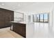 Modern kitchen features sleek cabinetry, stainless steel appliances, and a large island with countertop seating at 301 1St S St # 1206, St Petersburg, FL 33701