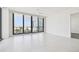 Light-filled living room with modern windows offering a breathtaking view of the city skyline at 301 1St S St # 1206, St Petersburg, FL 33701