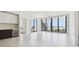 Open-concept living area with sleek flooring, cityscape view, and a modern wine fridge at 301 1St S St # 1206, St Petersburg, FL 33701