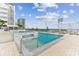 Beautiful condo pool with a wading area and lounge chairs overlooking the city skyline at 301 1St S St # 1206, St Petersburg, FL 33701