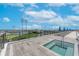 Relaxing rooftop deck features a hot tub, lounge chairs, and views of the city and stadium at 301 1St S St # 1206, St Petersburg, FL 33701