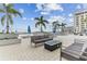 Condominium rooftop deck with a fire pit and comfortable seating, perfect for entertaining guests at 301 1St S St # 1206, St Petersburg, FL 33701