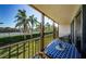 Charming outdoor balcony with seating and a view of the lush green surroundings, perfect for relaxation at 3021 Countryside Blvd # 26A, Clearwater, FL 33761