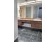 Bathroom features double sinks, a large mirror, and cabinets at 3021 Countryside Blvd # 26A, Clearwater, FL 33761