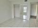 This bedroom features tile floors, mirrored closet doors, and an ensuite bath at 3021 Countryside Blvd # 26A, Clearwater, FL 33761